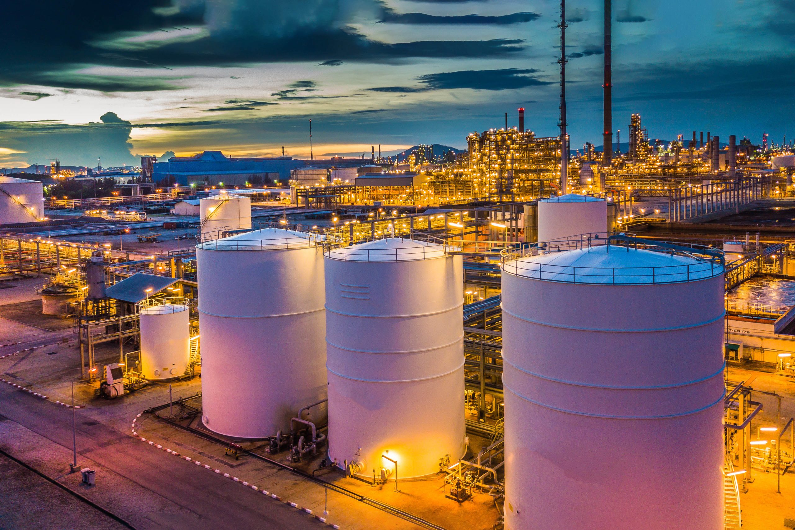 Aerial View Oil Terminal Is Industrial Facility For Storage Tank Of Oil And Petrochemical Industry Products Ready For Transport To Further Storage Facilities.